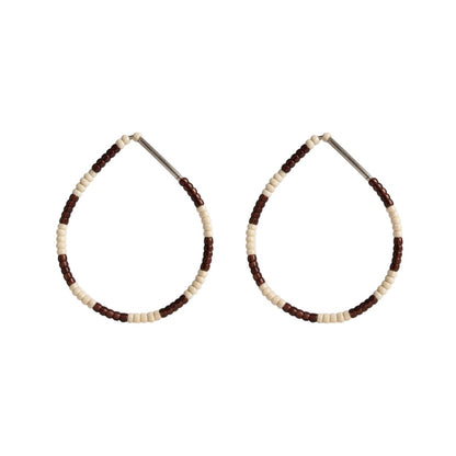 Pair of beaded hoop earrings with brown and beige beads on a white background