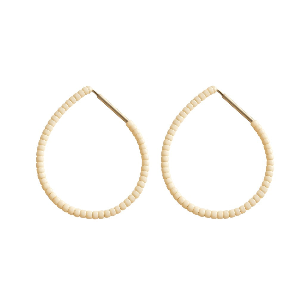 Butter Emmanuelle Hoops featuring cream white colour beads on silver hoops