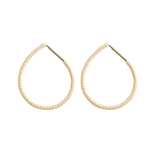 Butter Emmanuelle Hoops featuring cream white colour beads on silver hoops