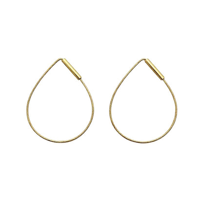 Gold hoop earrings on a white background
